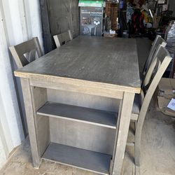 Table and 4 chairs cost $500