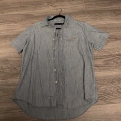 Polo Ralph Lauren Men's Short Sleeve Chambray Button Down Shirt in a classic light blue wash.