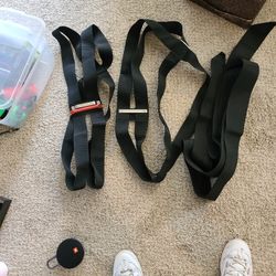 Moving straps, two people lift heavy object with ease