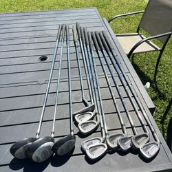 2 Sets Of Golf Clubs And Bags