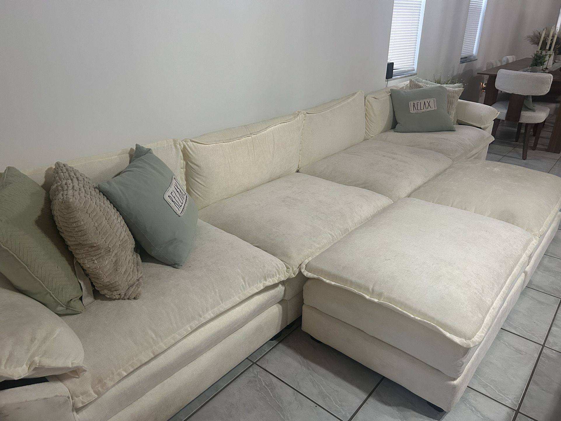 Large beige sectional couch 8 seater with 2 foot rest ottoman