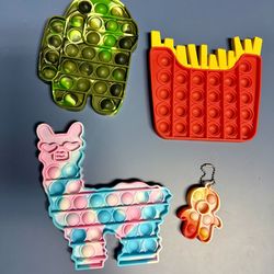Set Of Pop It Fidget Toys. Llama/Alpaca, French Fries, Among Us Spaceman. French fries, among us space man and lama/alpaca pop it toys. Great for anxi