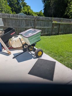 Pull behind seed spreader