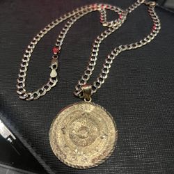 14 Kt curb chain & Aztec pendant
