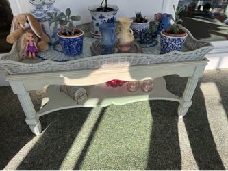 Off white coffee table with wicker basket top and glass insert