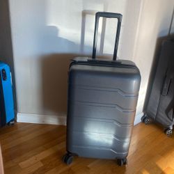 Slightly Used Open Story Suitcase