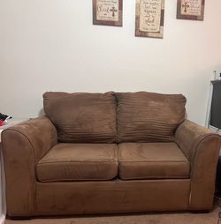 Brown sofa/Couch and Love Seat with Scotch Guard. The sofa has a beautiful queen size mattress. Seats 5 adults