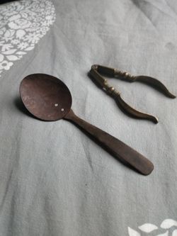 Vintage wooden spoon and brass miniature tongs