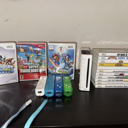 Wii + 4 Wii Remotes And 14 Games 