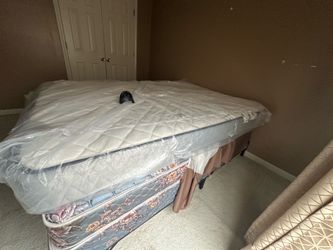Queen size mattress with box springs and base
