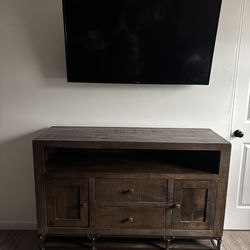 Rustic Industrial TV Stand with Metal Wheels
