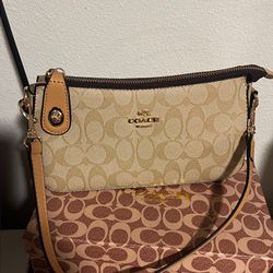beige coach bag