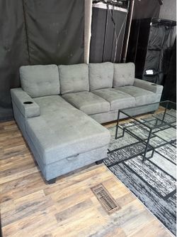 Sectional couch with cup holders and storage