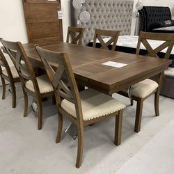 Rectangular extension dining table with cushioned chairs 