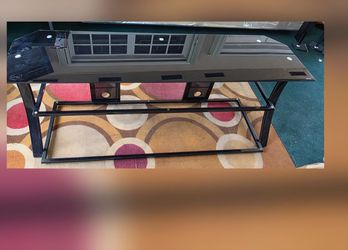 Black metal TV stand with tempered black glass