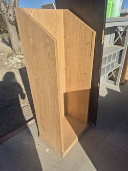 wooden lectern or standing podium commonly used in offices, schools, or churches for presentations.