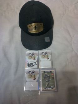 Reggie Bush Panini Flawless Base Autographed Card With 2 Like Cards And A 2006 Topps Reggie Bush Rookie Card, And A Saints Cap.