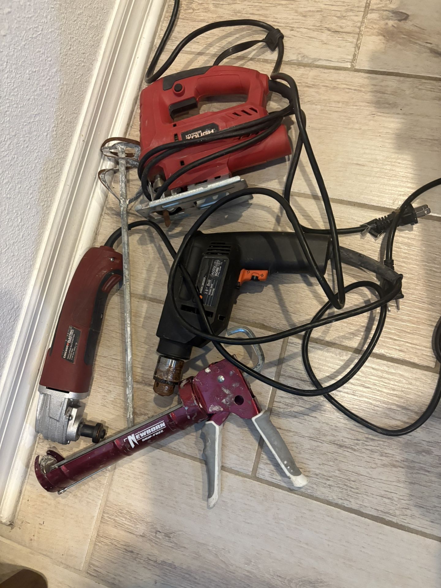 Bundle of drywall tools drills rule level spatula and more