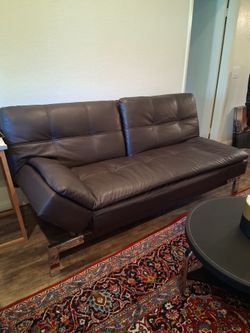 Dark Brown Leather Sofa with Chrome Legs. Pick it up in lake forest.
