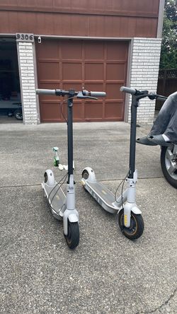 two Segway nine bot e scooters
