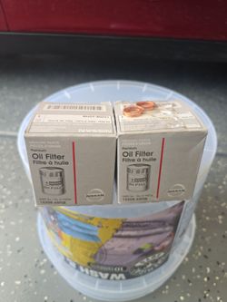 Two new OEM Nissan filters with two new crushable washers