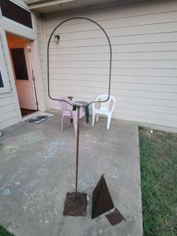 Garden decor. Pyramid bell chime and bird cage stand