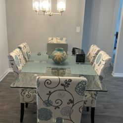 Glass Dining Room Table with 6 upholstered chairs