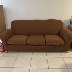 Red couch with Brown Cover 