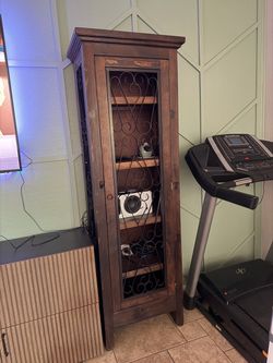Tall Dark Wood Cabinet with Scrolled Iron Door