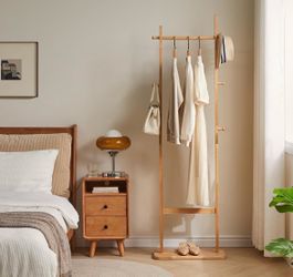 White wood and gold clothing rack