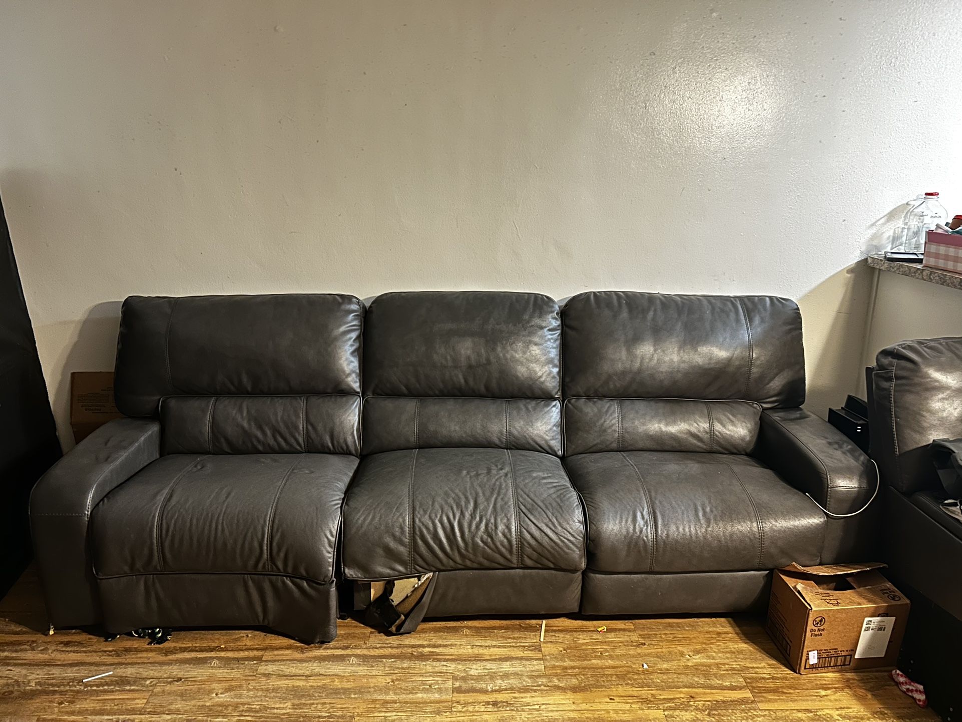 Leather couch with reclining seats