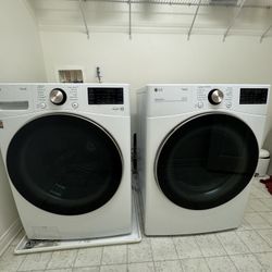 White LG Stackable smart front load washer and dryer.