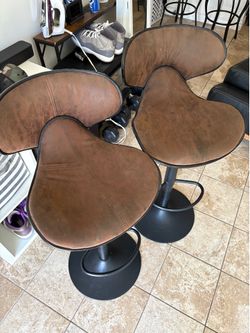 2 brown suede barstools