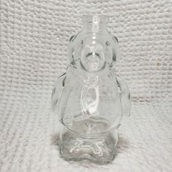 Polar bear glass syrup/honey  jar . Good condition and smoke free home.  Heavy glass bottle 7 3/4 inches tall with cover.   Holds 16.9 oz or 500 ml.