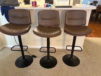 3 brown barstools