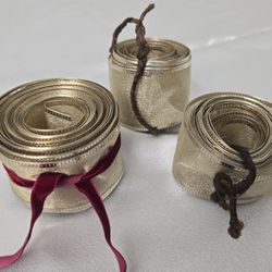 3 rolls of glittery champagne gold finish ribbon with wired edges
1 Unused, 2 partials. 