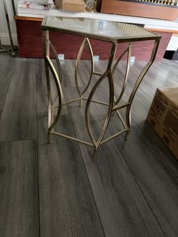 Gold hexagon Accent side table with glass top.