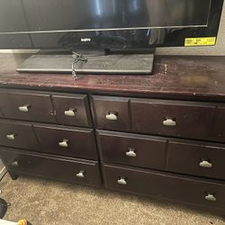 LARGE DARK BROWN WOODEN DRESSER WITH MIRROR ATTACHMENT