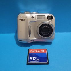 Nikon COOLPIX 2100 Digital Camera 2003 Silver + SanDisk 512MB CF Card - Working.
