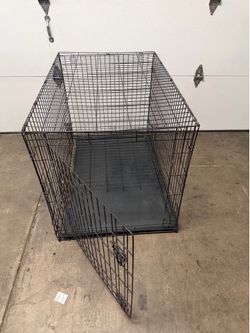 XL  single door dog crate measures 42L x 29W x 31H in