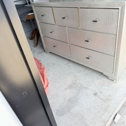 Wood  Big dresser 59 wide – 37 high – 16 deep All the drawers work well.