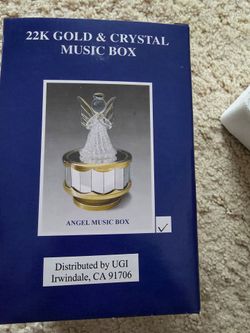 22 K gold and crystal music box.