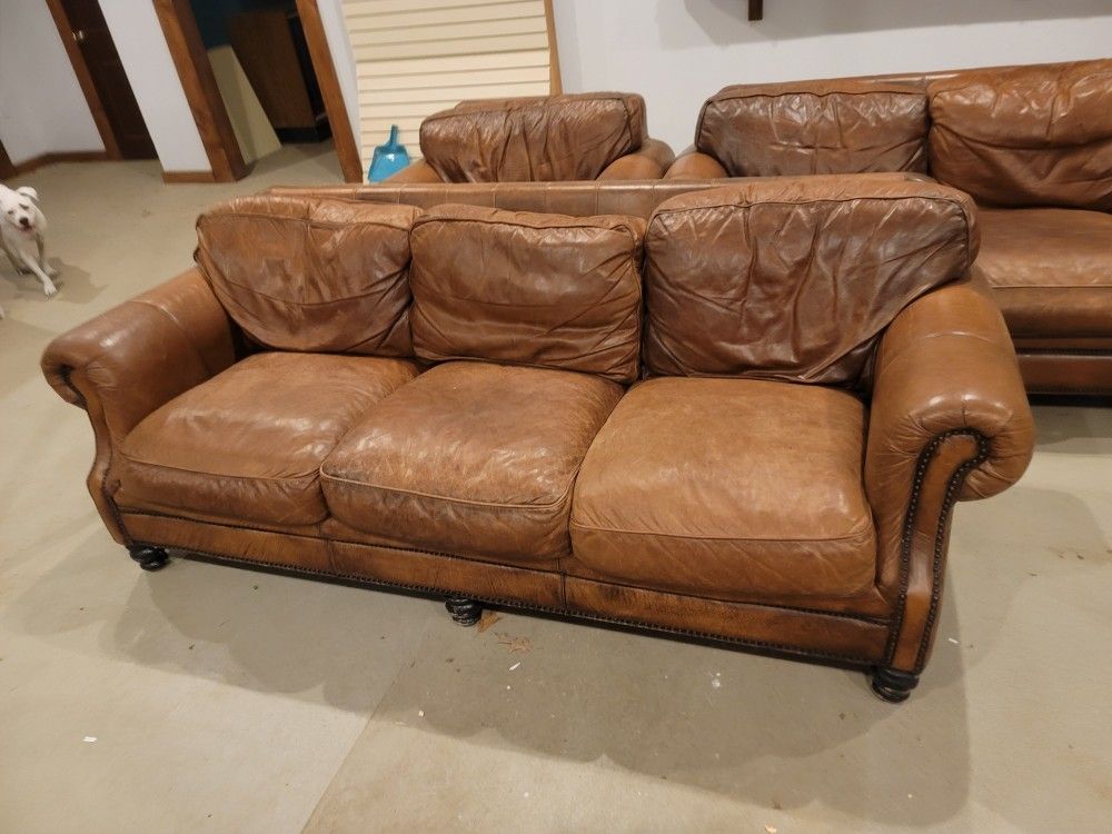 Brown Leather Couch, Love Seat, Chair, Foot Rest, And Coffee Table