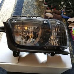 Pair of the 2013 Chevy camaro front headlights