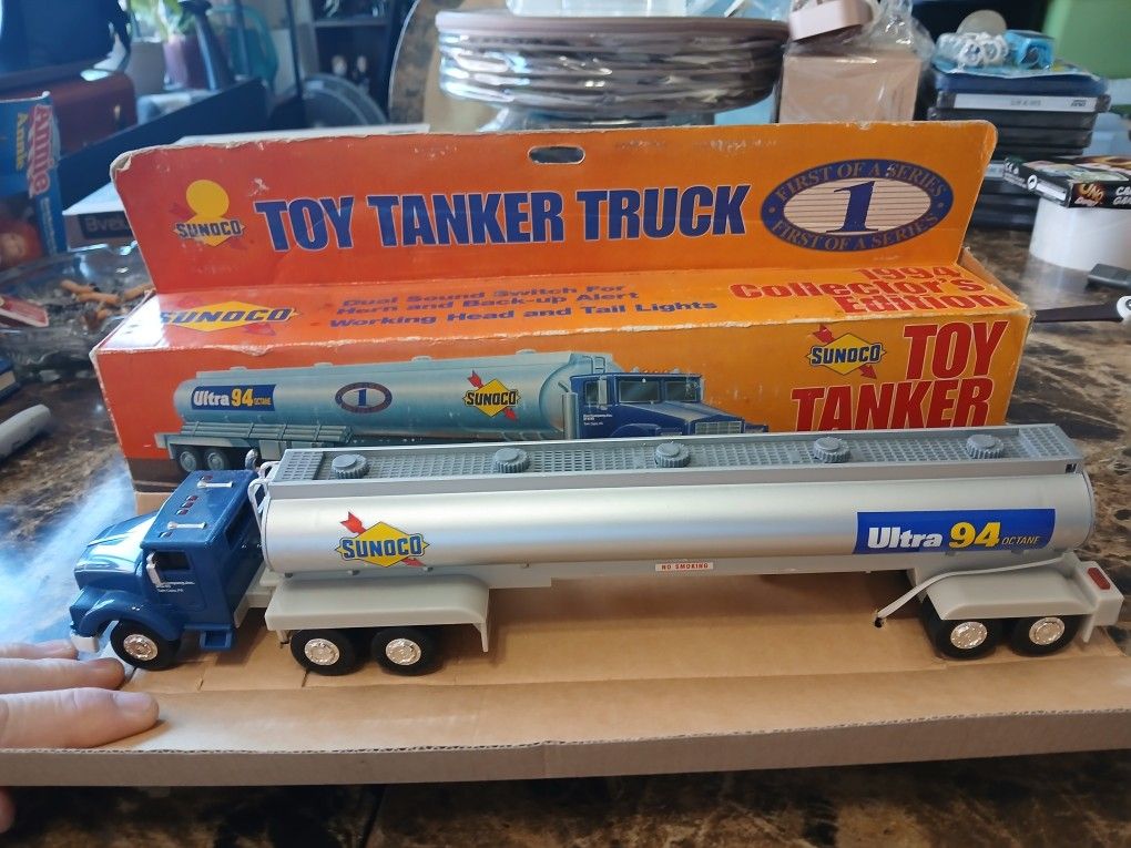 The product is a 1994 Sunoco Oil Tanker Truck, part of the First in the Series Collector's Edition. It is a 1:64 scale diecast model produced in 1994.