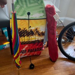 Boogie Board And Beach Umbrella With A Chair 
