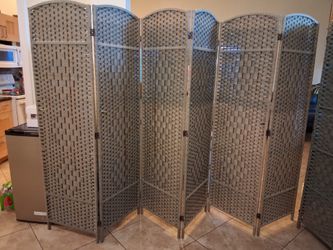 Woven gray wall partition