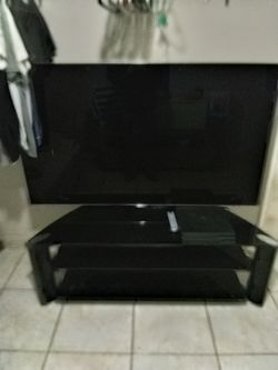 65" Smart TV And Stand