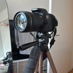 cannon EOS REBEL T5I , with 135 mm lens and tripod