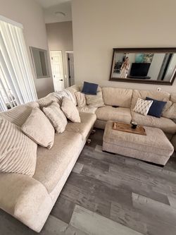 Beautiful cream colored sofa with arm chair side